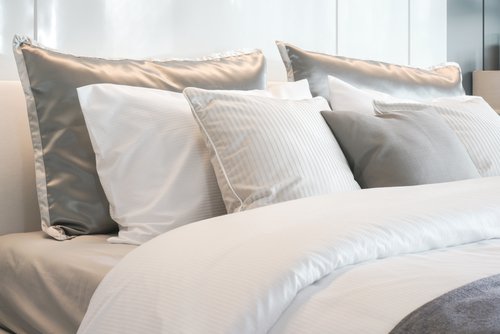 Luxurious bed with silk european pillows